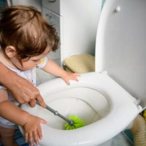 mom_and_daughter_cleaning_clogged_toilet.jpeg
