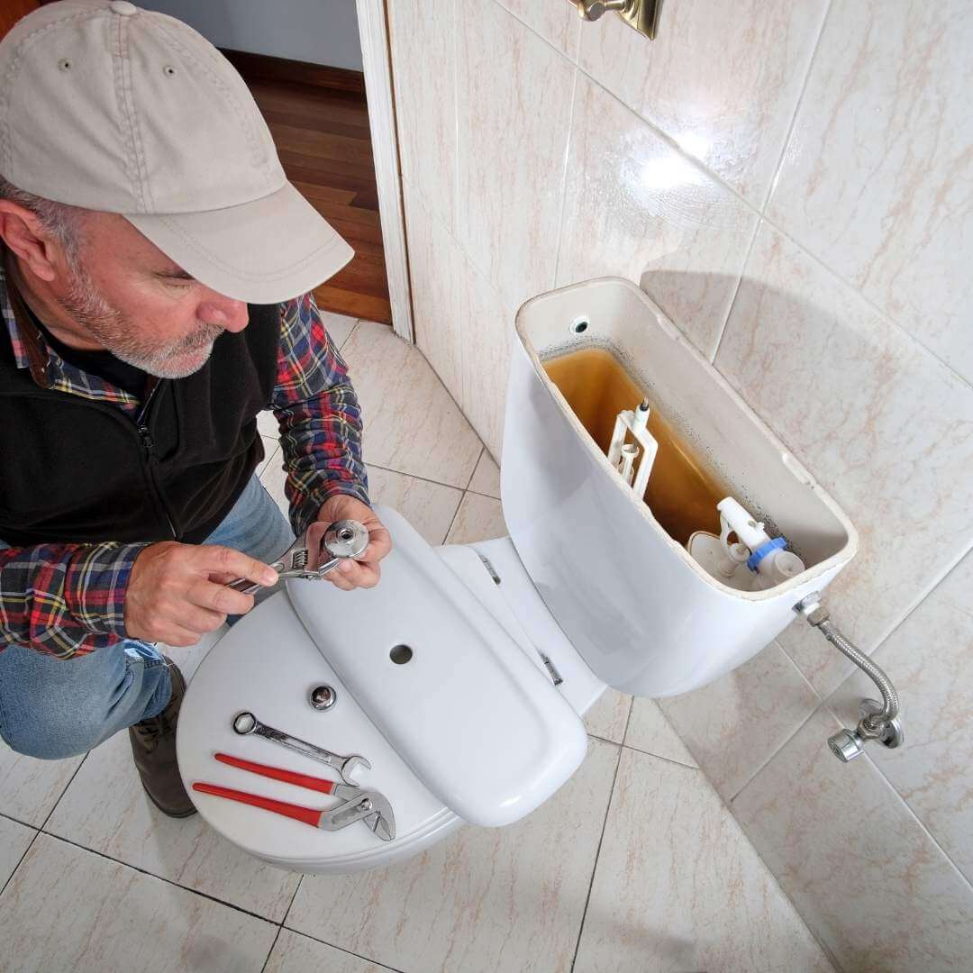 handyman_fixing_toilet.jpeg